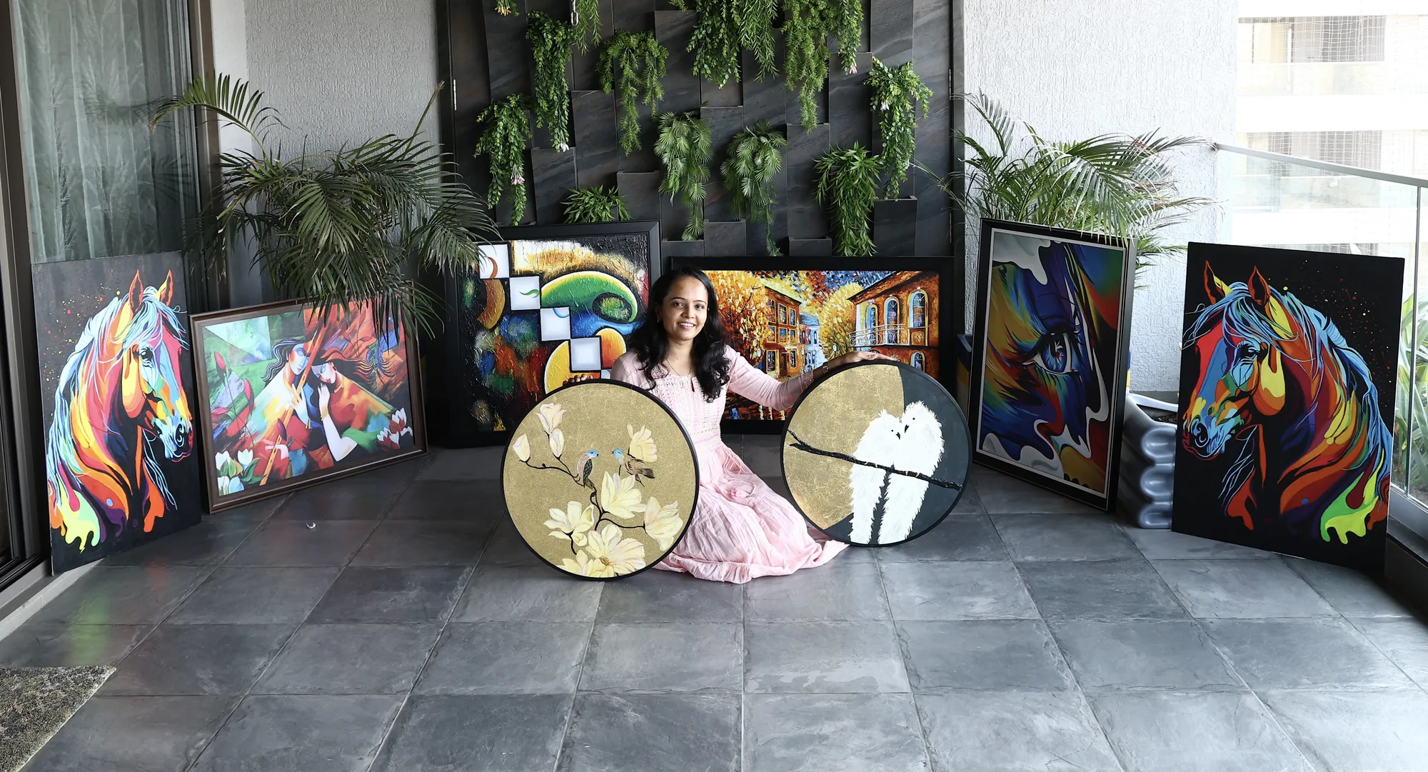 Darshana surrounded by her paintings